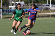 Bank of Guam Lady Strykers' Laurent Phillips moves the ball away from Islanders FC's Danni Jo Santos during a Week 9 match of the Bud Light Women's Soccer League Premier Division Sunday at the Guam Football Association National Training Center. The Lady Strykers won 2-0. Photo by Andee Tydingco / GFA