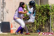 GW Gecko Andrea Ninete tags Southern Dolphin at third base. (Photo by Michael Blas)