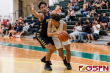 Harvest Eagle Taka Ward looks for the assist against Guam High Panther Damien Dela Cruz. (Photo by Michael Blas)