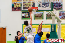 JFK Islander Ralf Manalac knocks in two points against Warriors Audrey Dela Cruz and Mac Dois. (Photo by Michael Blas)
