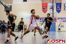 Okkodo Bulldog Rylen Cajigal breaks through the Islander defense for a shot at the basket. (Photo by Michael Blas)