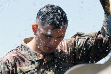 U.S. Army Staff Sgt. Joey J. Gogue, a California resident with Guam heritage, utilizes water from a tanker to wash off thick mud following the final phase of an event. The California Army National Guardsman competed in the 49th Military Police Brigade 2020 Best Warrior Competition (BWC) Aug. 8-12, 2020, at Camp Roberts, California, where he won the noncommissioned officer category after besting a field of 12 competitors. Gogue, of Santa Rosa, California, represented Forward Support Company, 579th Engineer Battalion. He is the 49th’s representation in November’s state-level BWC. If he wins again, Gogue will represent California in National Guard Bureau’s Regional BWC, where he will compete against top NCOs from Hawaii, Nevada, Colorado, Arizona, New Mexico, Utah and Guam. Guam was to host this year’s Regional BWC, but the coronavirus pandemic halted the May event. (U.S. Army National Guard photo by Staff Sgt. Eddie Siguenza)