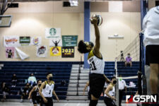 Tiyan High Titans VJ Rosario connects with the ball to bring it back over the net. Photo by Bout It Productions