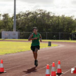 The Southern High Dolphins head north to The JFK Islanders turf for the ISA Cross Country Meet. Photo by Bout It Productions