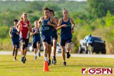 Guam High runners lead the pack up the steady incline at the midway point. (Photo by Michael Blas)