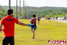 St. John's Knight Alex Clark sprints down the final stretch of the course. (Photo by Michael Blas)