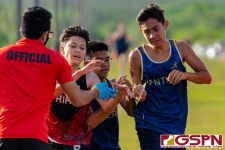 Runners collide as they reach the finish line. (Photo by Michael Blas)
