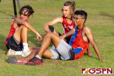 St. John's Knight runners rest after completing the course. (Photo by Michael Blas)