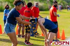 A Guam High Panthers fan hands out leis to Sameha Wilbanks after her race. (Photo by Michael Blas)