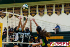 JFK Islander Isabella Roberto spikes over Sanchez Sharks Maria Amande and Kayna Kanemoto. (Photo by Michael Blas)