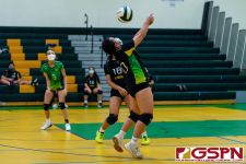 JFK Islander Hannah Hular sends the ball over on the last touch. (Photo by Michael Blas)
