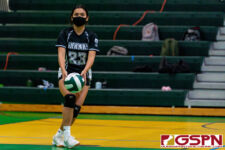 Sanchez Shark Teyha Mendiola locks in for straight points at the service line. (Photo by Michael Blas)