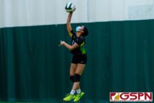 JFK Islander Maya Andres serves one up against the Sanchez Sharks in the third set. (Photo by Michael Blas)