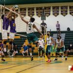 JFK Islander Mark Morales gets some air time with two defenders in front. Photo by Bout It Productions