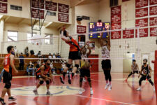 The FD Friars finished the season unbeaten, winning their final game over the home team St. John's Knights in four sets. (photo by Omar Nobuo)