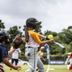 Team Rails Branwen Saville takes a swing in the 3rd Annual APL Womens Fast Pitch League held at the Piti Baseball Field. ( Photo by Bout It Productions )