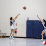 Academy Cougar Annika Almario sens one from downtown against the St. Paul Warriors. ( photo by Bout It Productions )