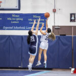 Academy Cougar Myka Terlaje attempt the shot over St. Paul Warrior Kat Santos. ( photo by Bout It Productions )