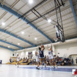 St. Paul Warrior La Hernandez takes a shot over Academy Cougar Myka Terlaje. ( photo by Bout It Productions )