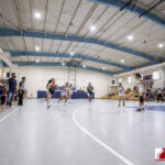 St. Paul Warrior Jan Quintanilla hussles down court aginst the Academy Cougars. ( photo by Bout It Productions )