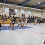 Academy Cougar Tona Guerrero looks to steal the ball from St. Paul Warrior Jan Quintanilla. ( photo by Bout It Productions )