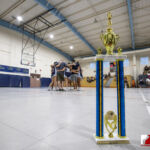 The St. Paul Warriors gather for one last huddle before receiving the Championship Trophy. ( photo by Bout It Productions )