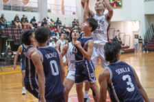 Friar Daryl Robles soars over the Warriors in the paint for two points. (photo by Raine Delos Reyes)