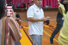 Friars head coach Eddie Pelkey takes in the scene after coaching his final high school basketball game as he's decided to retire from coaching. (photo by Raine Delos Reyes)