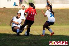 ND Royal Klowie Benavente clears the ball off St. John's Knight Annie Jones. (Photo by Michael Blas)