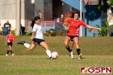 ND Royal Maya Iriarte clears the ball off St. John's Knight Annie Jones. (Photo by Michael Blas)