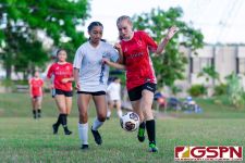 ND Royal Dolores San Gil and St. John's Knight fight for the ball. (Photo by Michael Blas)