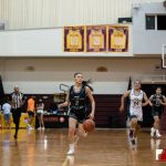 Team Supreme Janniliese Quintanilla dribbles down court against Team Elite. (photo by Bout It Productions)