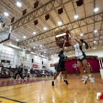 Team Elite Myka Jo Terlaje attempts a shot over Team Supreme Anaya Mudzimurema. (photo by Bout It Productions)