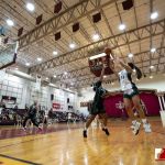 Team Elite Myka Jo Terlaje attempts a shot over Team Supreme Anaya Mudzimurema. (photo by Bout It Productions)