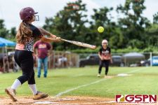 Peaches Kiana Palomo sends the ball out to left field. (Photo by Michael Blas)