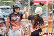 Peaches Meagan Maratita and Sierra Tenorio celebrate on a good inning. (Photo by Michael Blas)