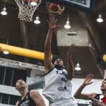 Team Guam's Tai Wesley hustles in the paint while Team Chinese Taipei looks on. (photo by Bout It Productions)