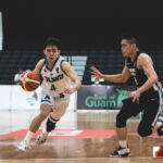 Team Guam's Tomas Calvo dribbles down court while Team Chinese Taipei's Ying-Chun Chen looks to defend. (photo by Bout It Productions)