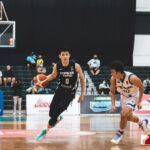 Team Chinese Taipei's Ting-Chien Lin dribbles down court while Team Guam's Takumi Simon looks to defend. (photo by Bout It Productions)
