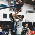 Team Chinese Taipei's Chi-Wei Lee & Team Guam's Tai Wesley battle for the ball in the FIBA Asia Qualifier. Team Guam supporters cheer on their team in the FIBA Asia Qualifier at the UOG Calvo Fieldhouse. (photo by Bout It Productions)