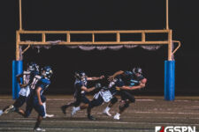 Southern High Dolphin Isaiah Topasna breaks away from the Panthers defense. (photo by Bout It Productions)
