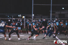 Southern High Dolphin Zavier Camacho takes the ball downfield to move the chains. (photo by Bout It Productions)
