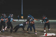 Guam High Panther Benjamin Harris carries the ball for the first down late in the 2nd quarter. (photo by Bout It Productions)
