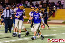 GW Gecko Jake Cruz and fellow teammates celebrate after scoring a touchdown. (Photo by Michael Blas)