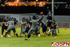 SHS Dolphin Kyler Aflleje attempts to deflect a pass to JFK Islander Taiyo Kanekatsu. (Photo by Michael Blas)