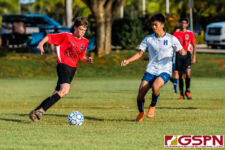 SJS Knight Isaac Phillips looks for an opening against HCA Eagle Christian Shinohara. (Photo by Michael Blas)