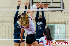 SJS Knight Wendy Zheng spikes through AOLG Cougars Gabriella Mata and Melanie Damian for a kill. (Photo by Michael Blas)