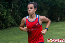St. John's Knights Luca Flores stays focused through the midway point of the race. (Photo by Michael Blas)
