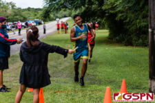 Guahan Academy Starfish Tre Muna crosses the finish line first for his team. (Photo by Michael Blas)
