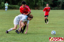 HCA Eagle Levie Buckwalter and SJS Knight Erren Chen get physical on the field. (Photo by Michael Blas)